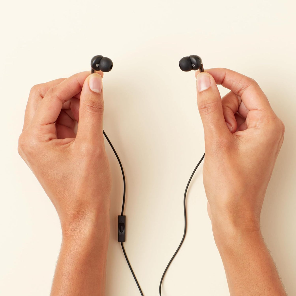 Amazon Basics Wired Earbuds with Microphone. In-Ear Headphones. 3.5mm Jack. High Definition Sound. Secure Fit. 4.2 ft Cable. S/M/L Ear Tips. Black